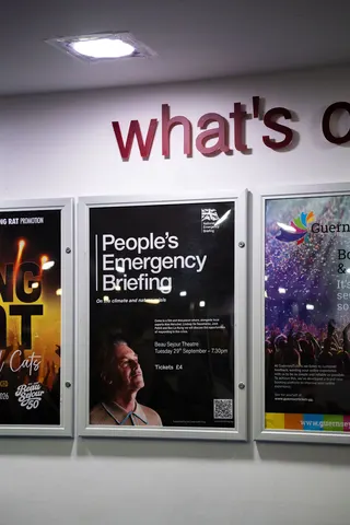 A poster for the film on a noticeboard in the venue